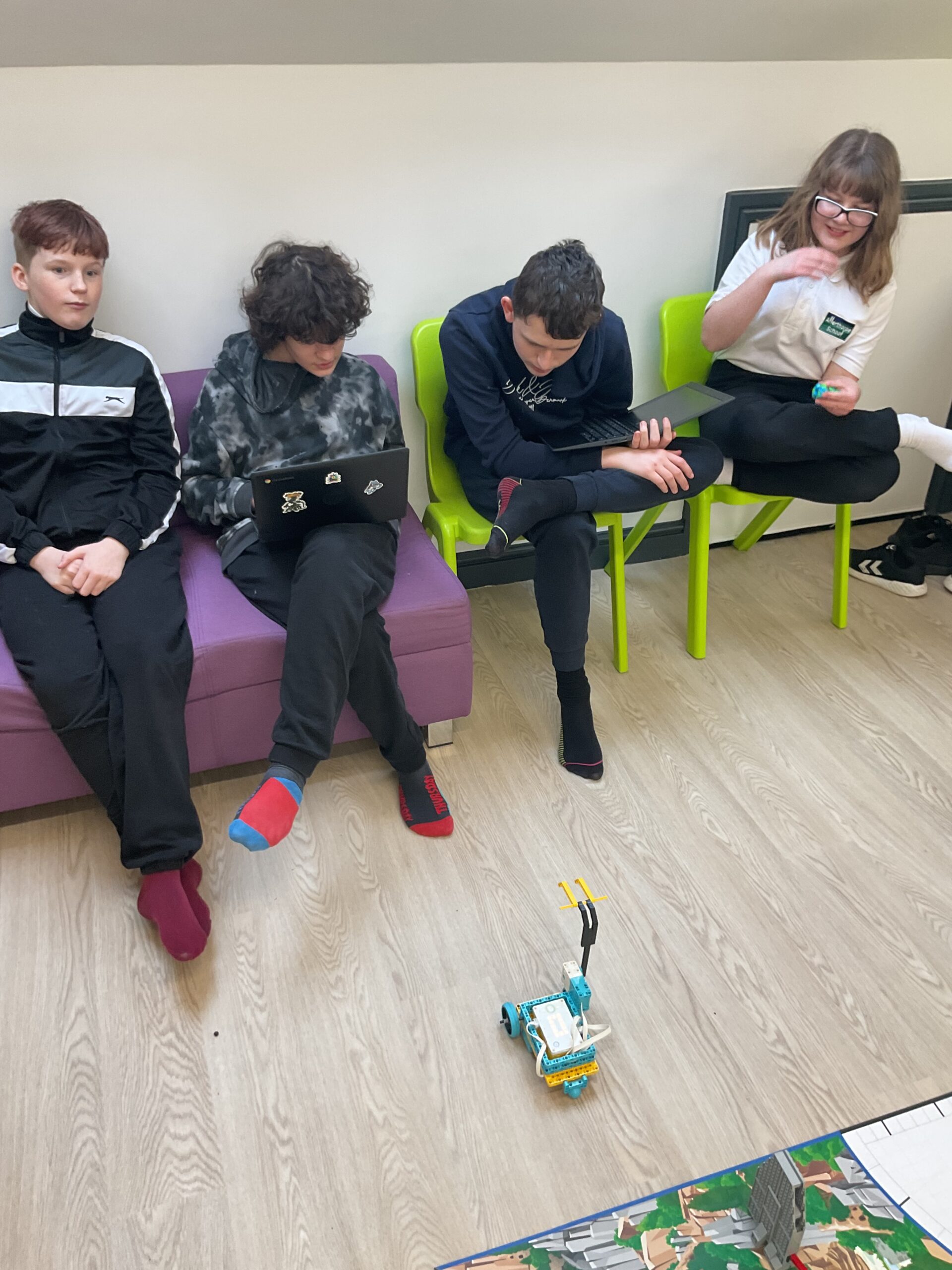 Teams of learners developing coding and engineering skills as part of the Unearthed LEGO® League challenge.