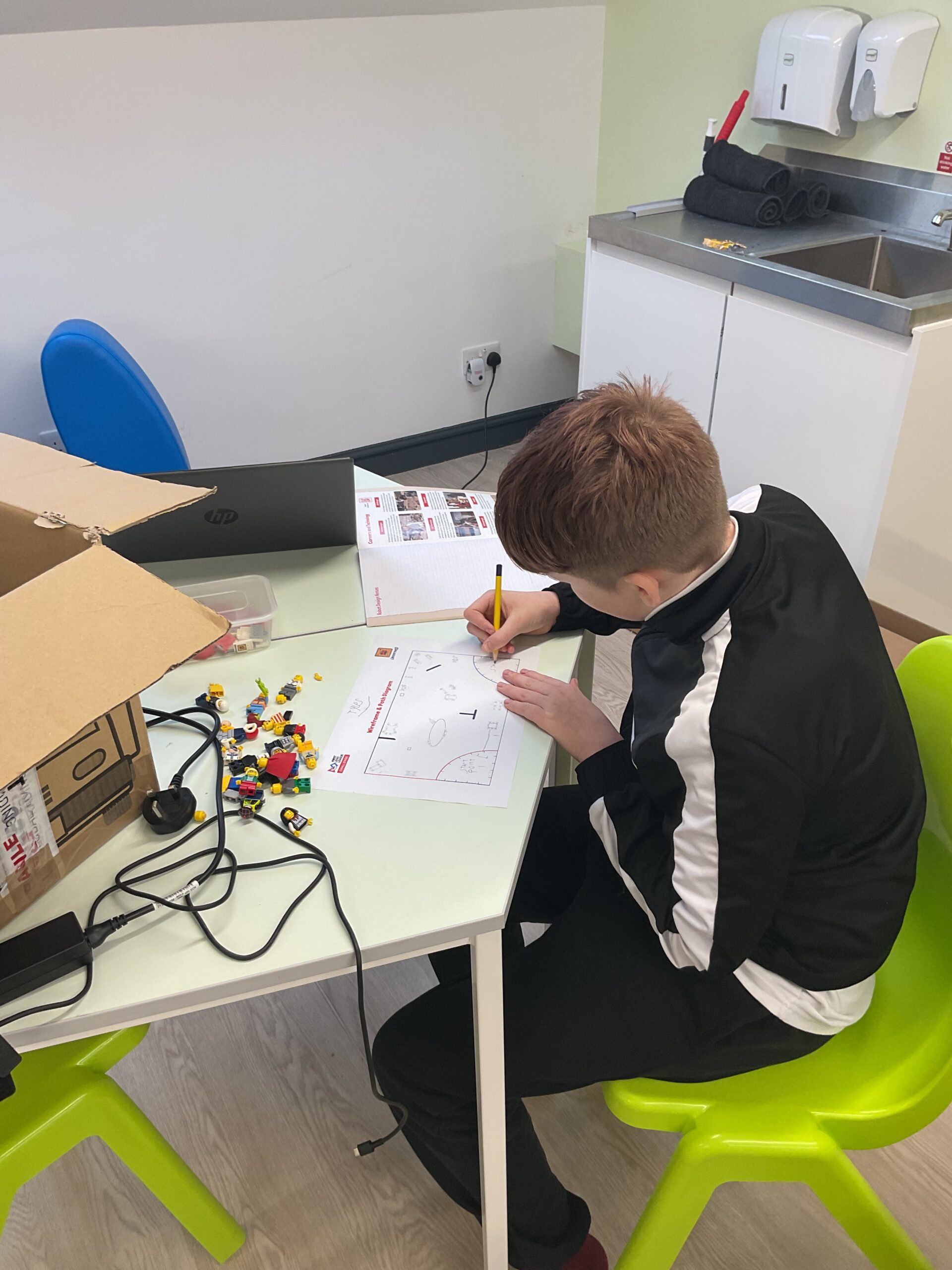 Learners collaborating on research projects and robot missions for the FIRST® LEGO® League.